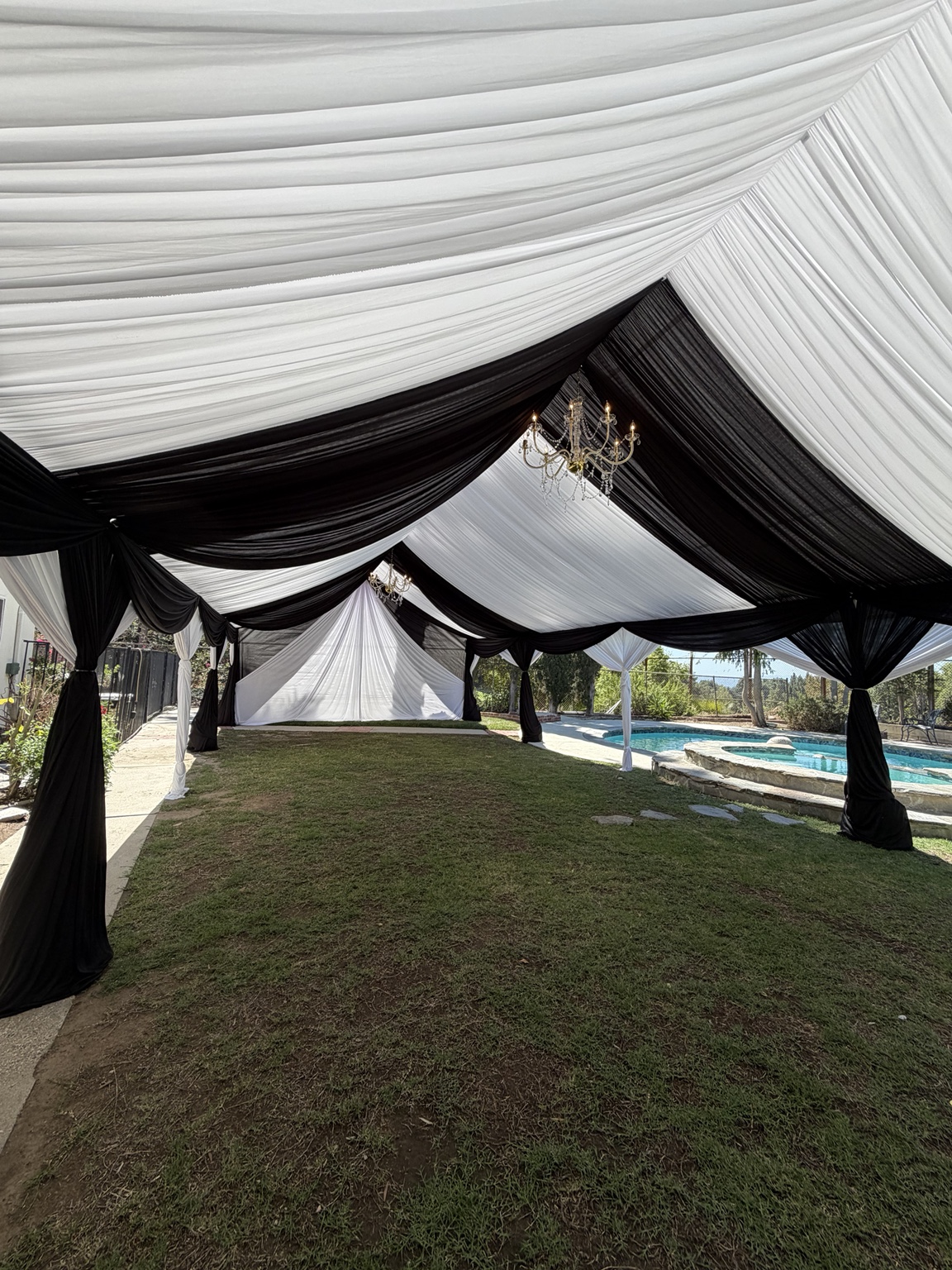 Black and white ceiling draping inside a tent