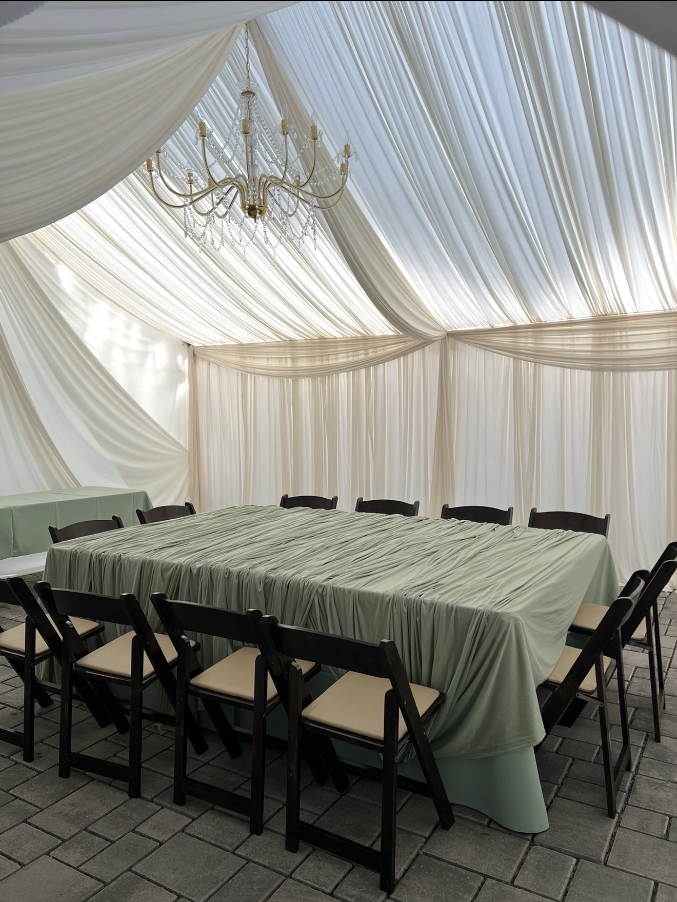 Ivory tent draping with sage table linens