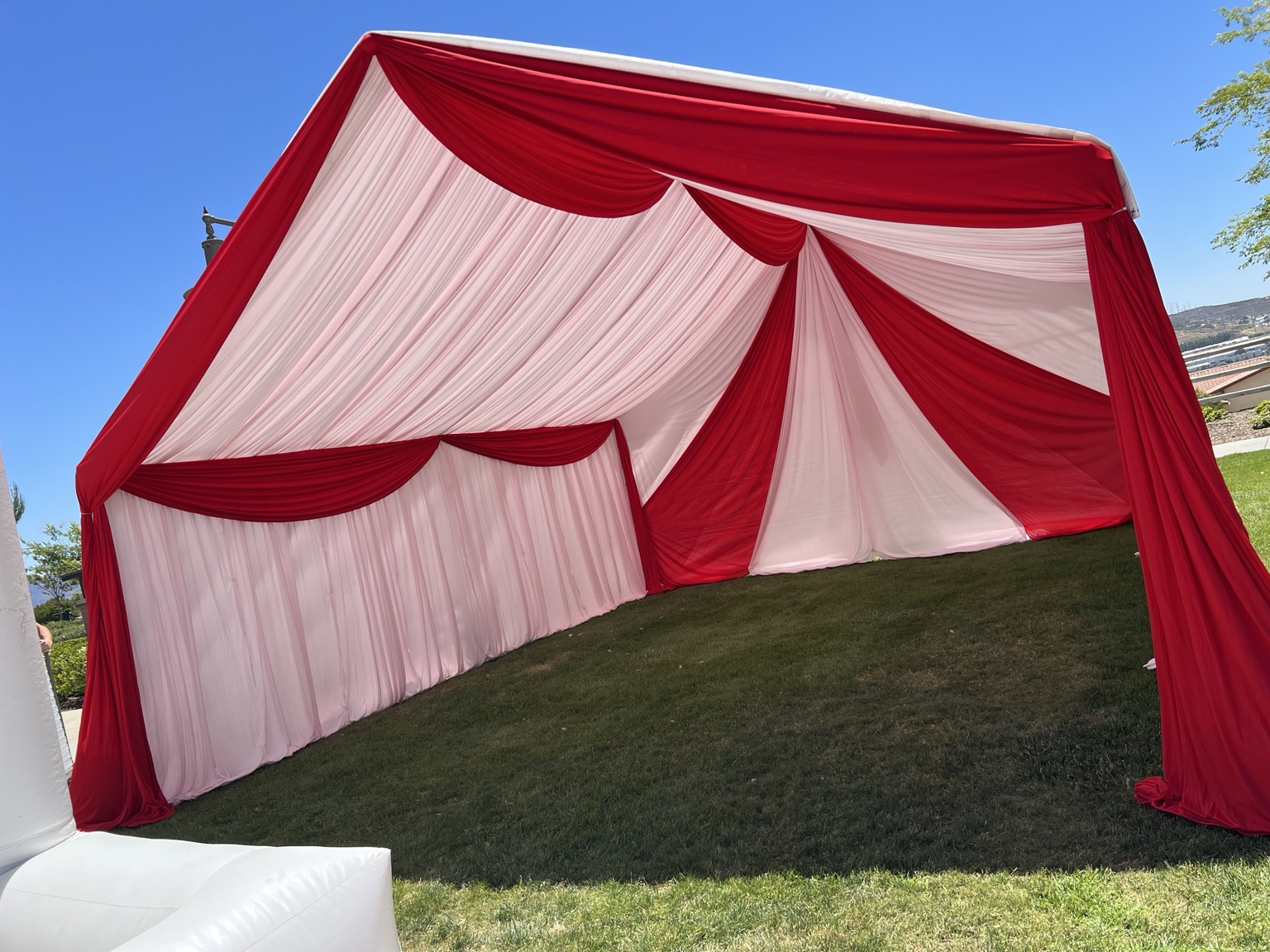 Red and white draping on an outdoor tent