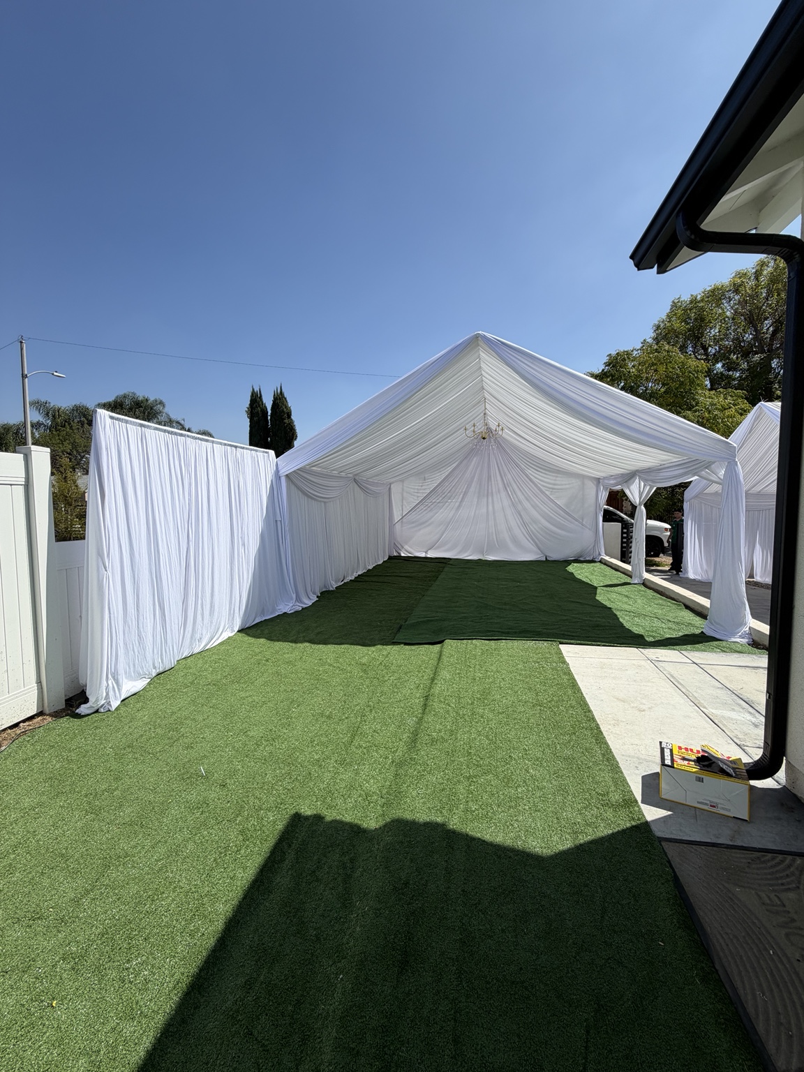 White outdoor tent with full draping